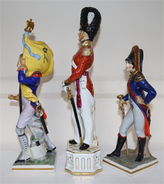Two German porcelain models of Napoleonic soldiers and another of officer of the Grenadier Guards, 24cm - 31.5cm